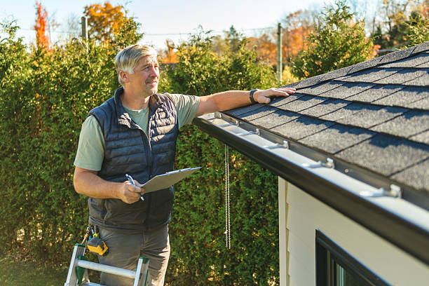 Professional Hail Damage Roof Repair technician working in Marshall, IL